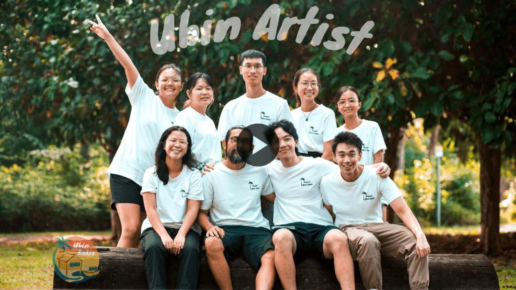 The ubin kakis team smiling and posing for the camera with Terence Tan in the middle. 